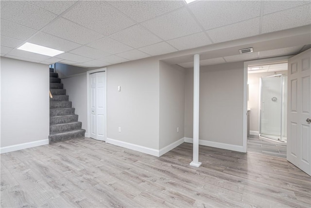 33 Perennial Dr, Cranston, RI 02920 - finished basement with wood finished floors, baseboards, stairs, and a drop ceiling