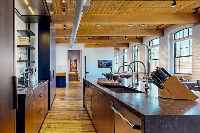 kitchen with open shelves, rail lighting, wood ceiling, light wood finished floors, and dishwasher