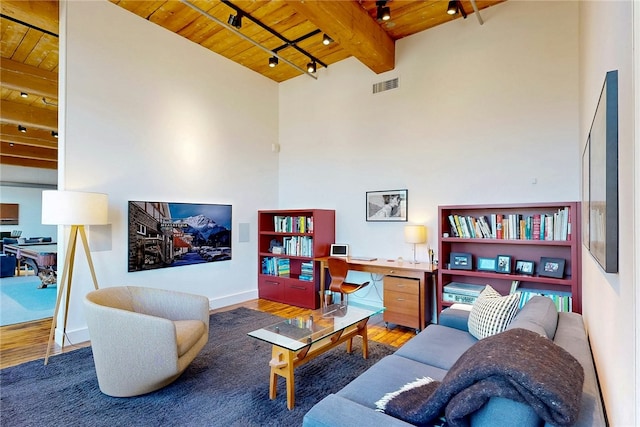living room featuring wooden ceiling, wood finished floors, beam ceiling, and an office area