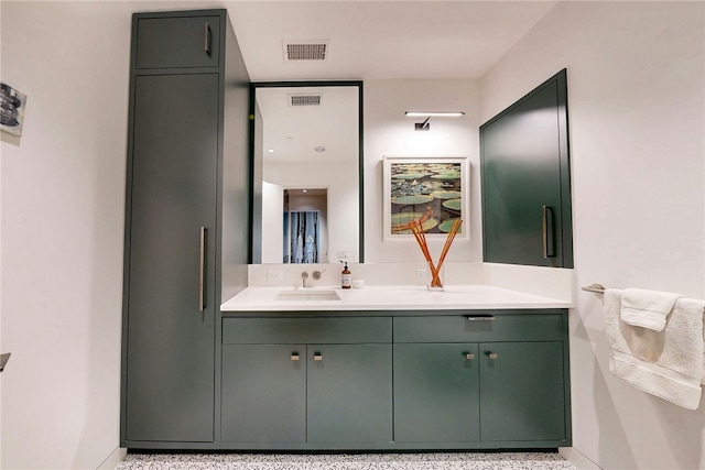 bathroom with baseboards and vanity