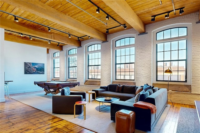 community lobby with wooden ceiling and brick wall