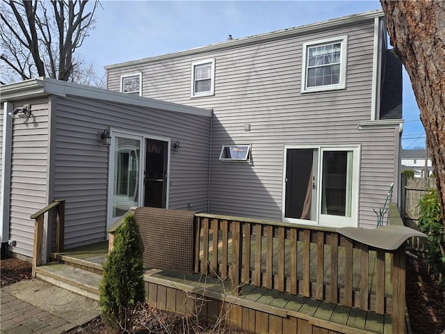 back of house with a wooden deck