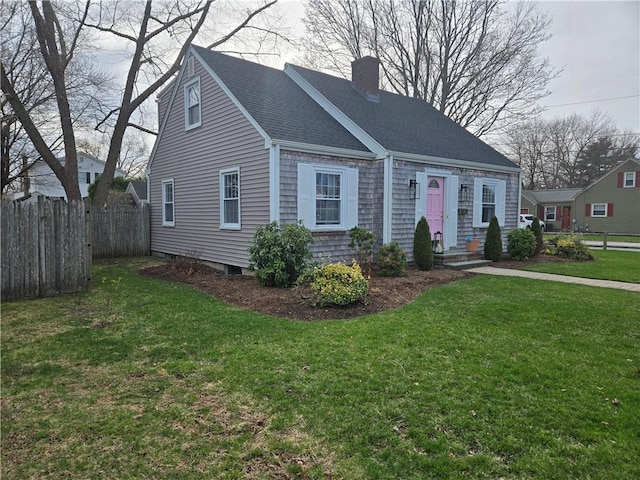 view of front of property with a chimney and roof with shingles
