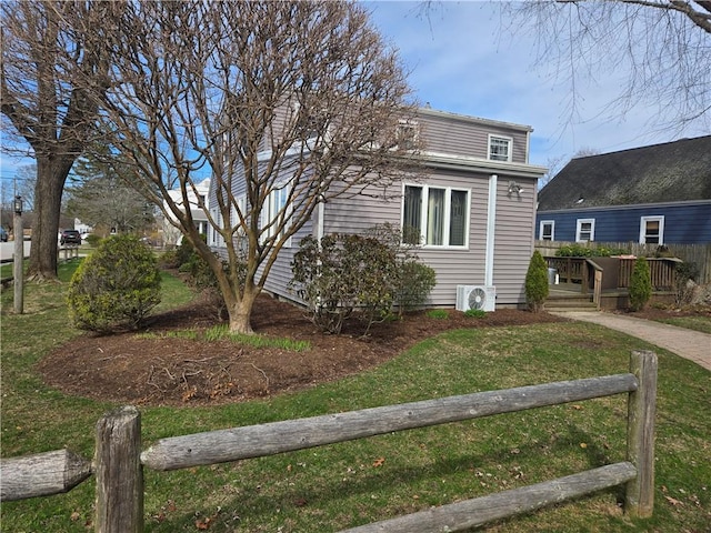 view of front of house featuring ac unit and a wooden deck
