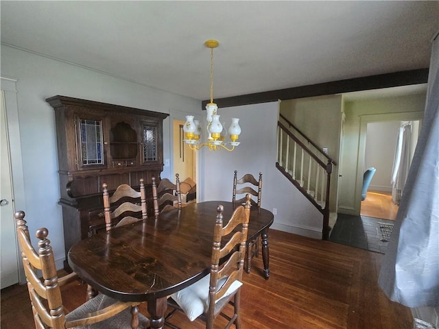 dining area featuring a chandelier, stairs, wood finished floors, and baseboards