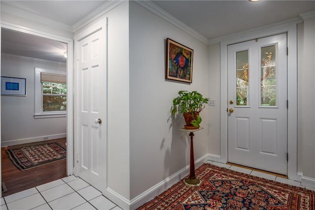 2 Cherry Ln, Bristol, RI 02809 - entryway with crown molding, light tile patterned flooring, and baseboards