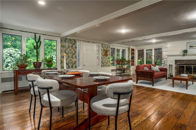 2 Cherry Ln, Bristol, RI 02809 - dining area with ornamental molding, hardwood / wood-style flooring, a wainscoted wall, a decorative wall, and a glass covered fireplace