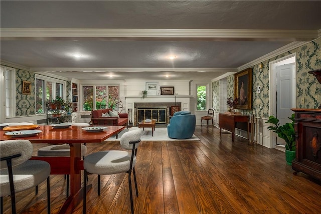 2 Cherry Ln, Bristol, RI 02809 - dining area featuring wallpapered walls, ornamental molding, wood-type flooring, a glass covered fireplace, and a decorative wall