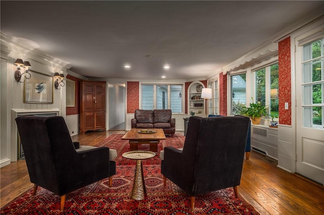 2 Cherry Ln, Bristol, RI 02809 - living area featuring dark wood-style floors, ornamental molding, and built in shelves