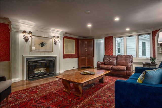 2 Cherry Ln, Bristol, RI 02809 - living room featuring crown molding, wood finished floors, a fireplace with flush hearth, wainscoting, and recessed lighting