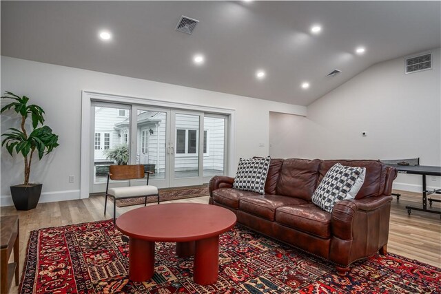 2 Cherry Ln, Bristol, RI 02809 - living area with wood finished floors, lofted ceiling, recessed lighting, and baseboards