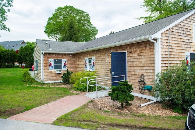 2 Cherry Ln, Bristol, RI 02809 - view of front of home featuring a front yard and a shingled roof