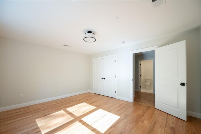 145 Wolf Rock Rd, Exeter, RI 02822 - unfurnished bedroom with light wood-style floors, baseboards, and a closet