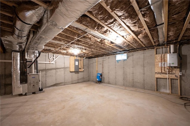 145 Wolf Rock Rd, Exeter, RI 02822 - basement with electric panel, heating unit, and tankless water heater
