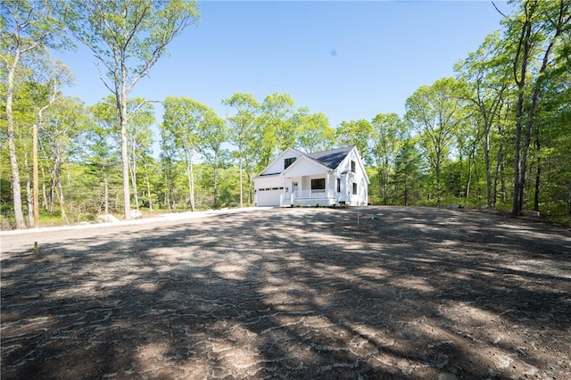 145 Wolf Rock Rd, Exeter, RI 02822 - view of home's exterior featuring a garage and driveway