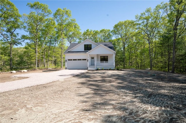 145 Wolf Rock Rd, Exeter, RI 02822 - modern inspired farmhouse featuring dirt driveway, covered porch, and an attached garage