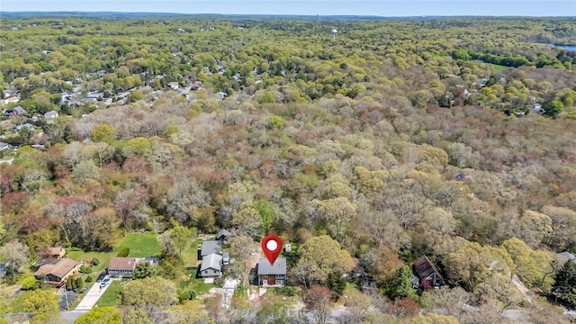 view of property location featuring a heavily wooded area