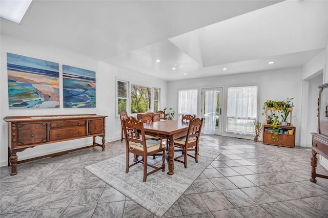 dining area featuring recessed lighting and baseboards