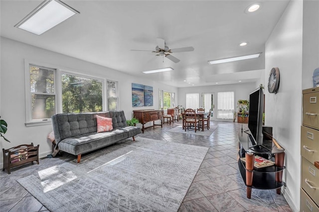 living area with ceiling fan, recessed lighting, and tile patterned flooring