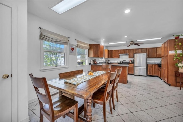 dining room with light tile patterned floors, recessed lighting, a ceiling fan, and baseboards