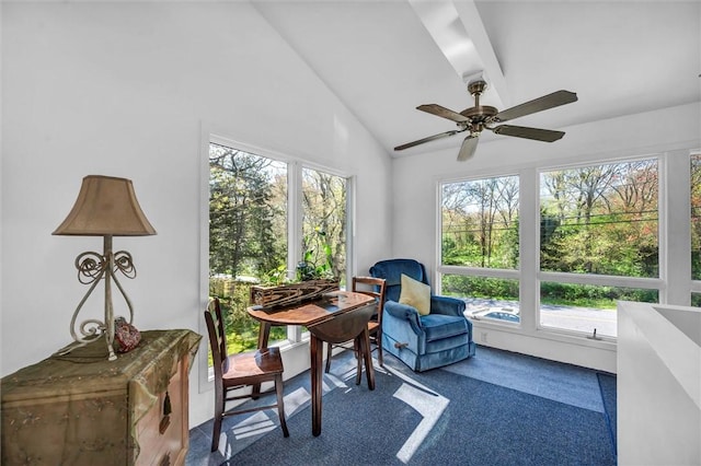 office area with vaulted ceiling, carpet flooring, and a ceiling fan