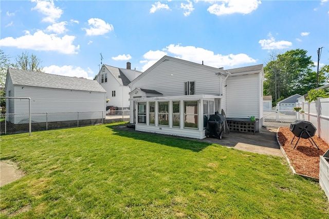 back of property with a patio