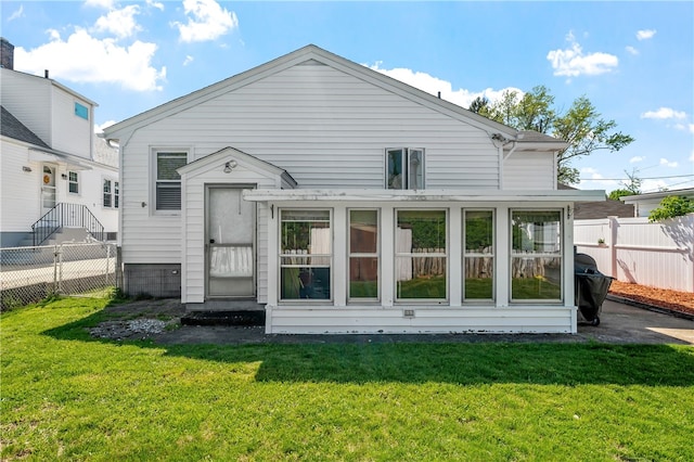 rear view of house with a sunroom