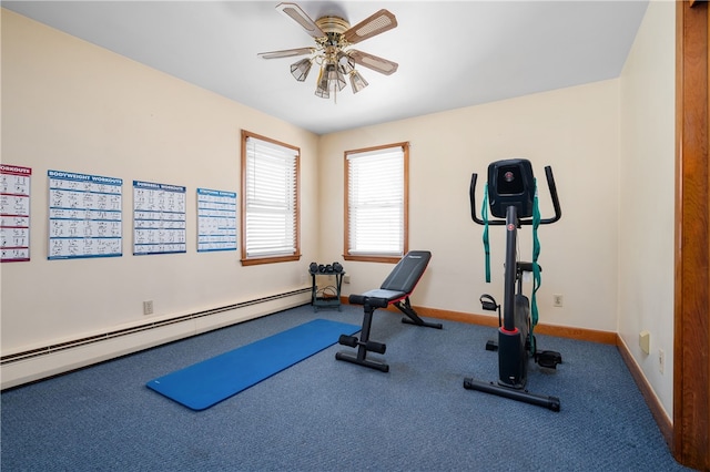 exercise room featuring a baseboard heating unit, a ceiling fan, baseboards, and carpet floors