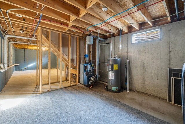 38 Brook St, Central Falls, RI 02863 - basement with water heater and a heating unit