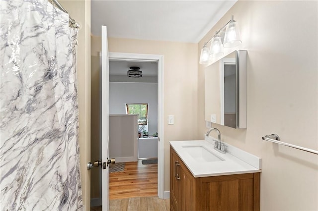 795 S Main St, Burrillville, RI 02859 - full bath featuring wood finished floors, vanity, and a shower with curtain