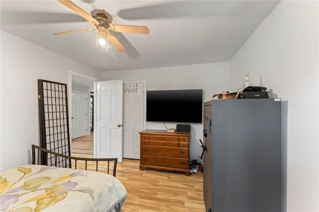 795 S Main St, Burrillville, RI 02859 - bedroom with light wood-style flooring, freestanding refrigerator, and ceiling fan