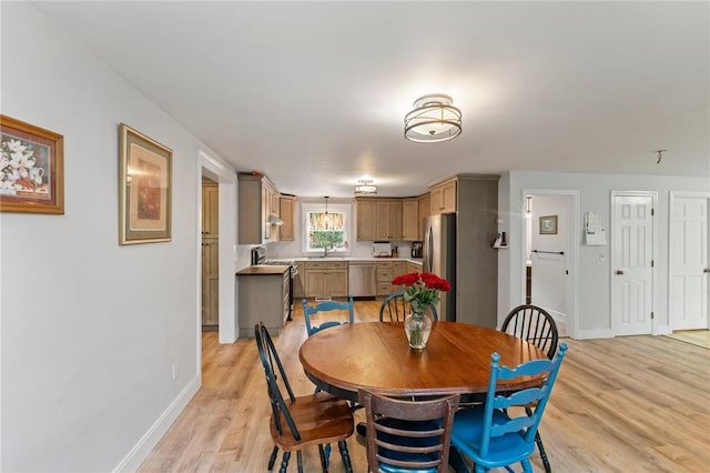 795 S Main St, Burrillville, RI 02859 - dining space featuring light wood-style flooring and baseboards