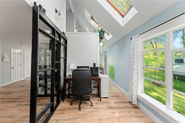 795 S Main St, Burrillville, RI 02859 - home office with a skylight, wood finished floors, baseboards, and vaulted ceiling