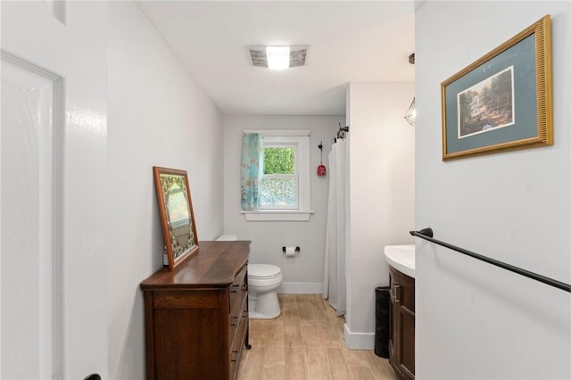 795 S Main St, Burrillville, RI 02859 - bathroom with vanity, wood finished floors, toilet, baseboards, and curtained shower
