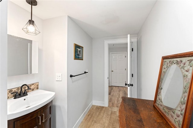 795 S Main St, Burrillville, RI 02859 - bathroom with wood finished floors, baseboards, and vanity