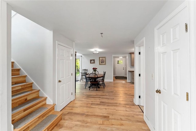 795 S Main St, Burrillville, RI 02859 - corridor with light wood finished floors, stairway, and baseboards