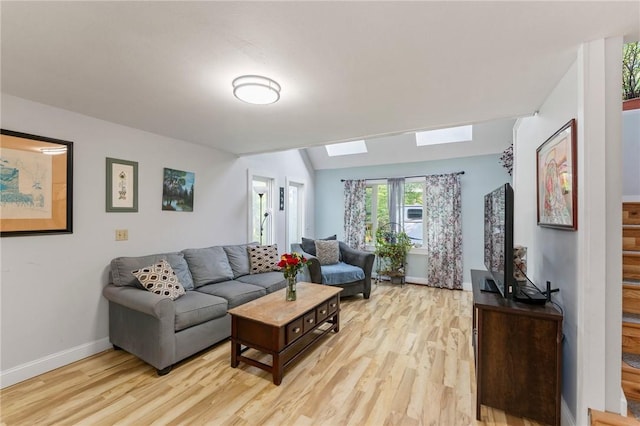 795 S Main St, Burrillville, RI 02859 - living area featuring light wood-style flooring, a skylight, and baseboards