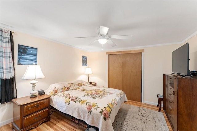 795 S Main St, Burrillville, RI 02859 - bedroom featuring light wood-style floors, a closet, ceiling fan, and crown molding