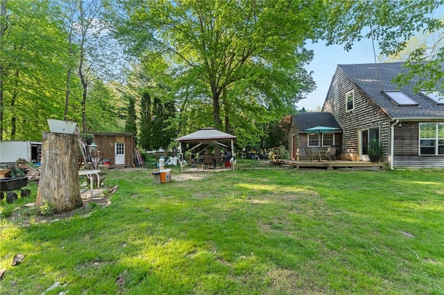 795 S Main St, Burrillville, RI 02859 - view of green lawn with a gazebo, a deck, a storage unit, and an outdoor structure