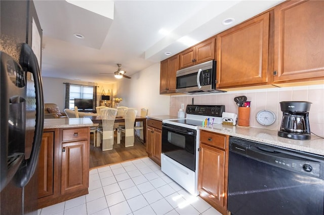 3399 Post Rd Unit 7, Warwick, RI 02886 - kitchen featuring black appliances, ceiling fan, brown cabinets, decorative backsplash, and light tile patterned floors