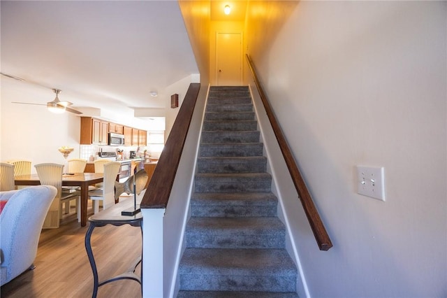 3399 Post Rd Unit 7, Warwick, RI 02886 - stairway featuring ceiling fan and wood finished floors