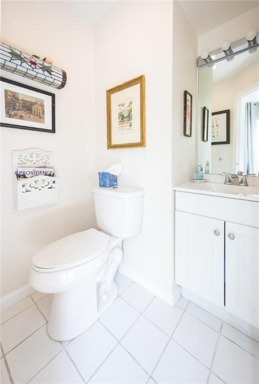 3399 Post Rd Unit 7, Warwick, RI 02886 - bathroom featuring toilet, baseboards, tile patterned flooring, and vanity