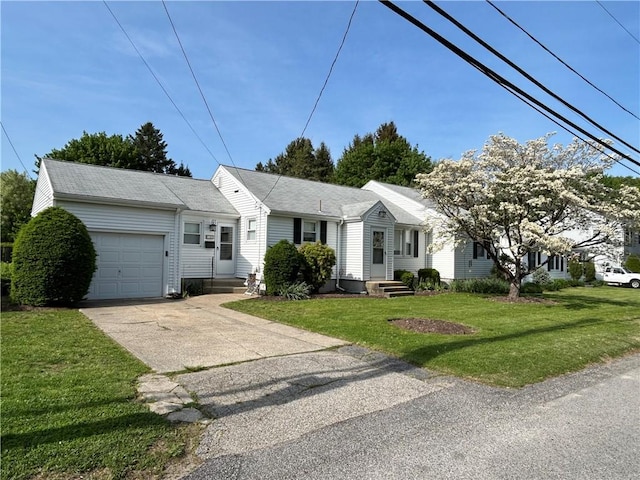 122 Cannon St, Cranston, RI 02920 - ranch-style home with an attached garage, driveway, and a front lawn