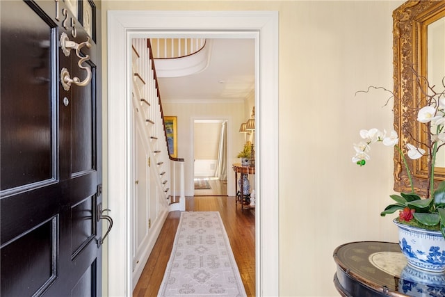 125 Grotto Ave, Providence, RI 02906 - entryway featuring stairs, wood finished floors, and ornamental molding