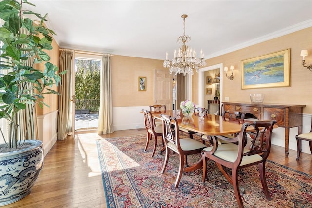 125 Grotto Ave, Providence, RI 02906 - dining space featuring a chandelier, light wood-style flooring, and ornamental molding