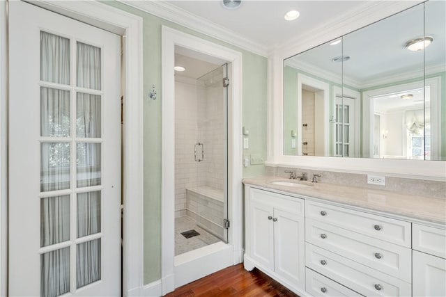 125 Grotto Ave, Providence, RI 02906 - bathroom with a shower stall, ornamental molding, vanity, and wood finished floors