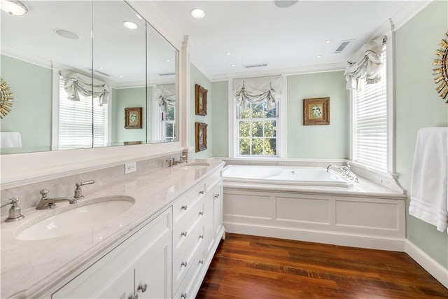 125 Grotto Ave, Providence, RI 02906 - bathroom with wood-type flooring, ornamental molding, a garden tub, and double vanity