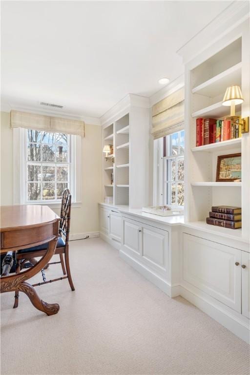 125 Grotto Ave, Providence, RI 02906 - dining area featuring light colored carpet, plenty of natural light, crown molding, and baseboards