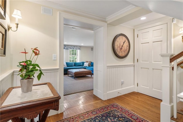 125 Grotto Ave, Providence, RI 02906 - entryway featuring wainscoting, wood finished floors, crown molding, and stairway