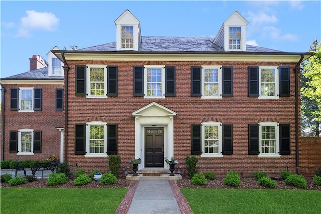 125 Grotto Ave, Providence, RI 02906 - colonial house with brick siding and a front yard